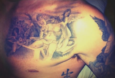 Brooklyn Beckham chest tattoo of Cupid unveiled